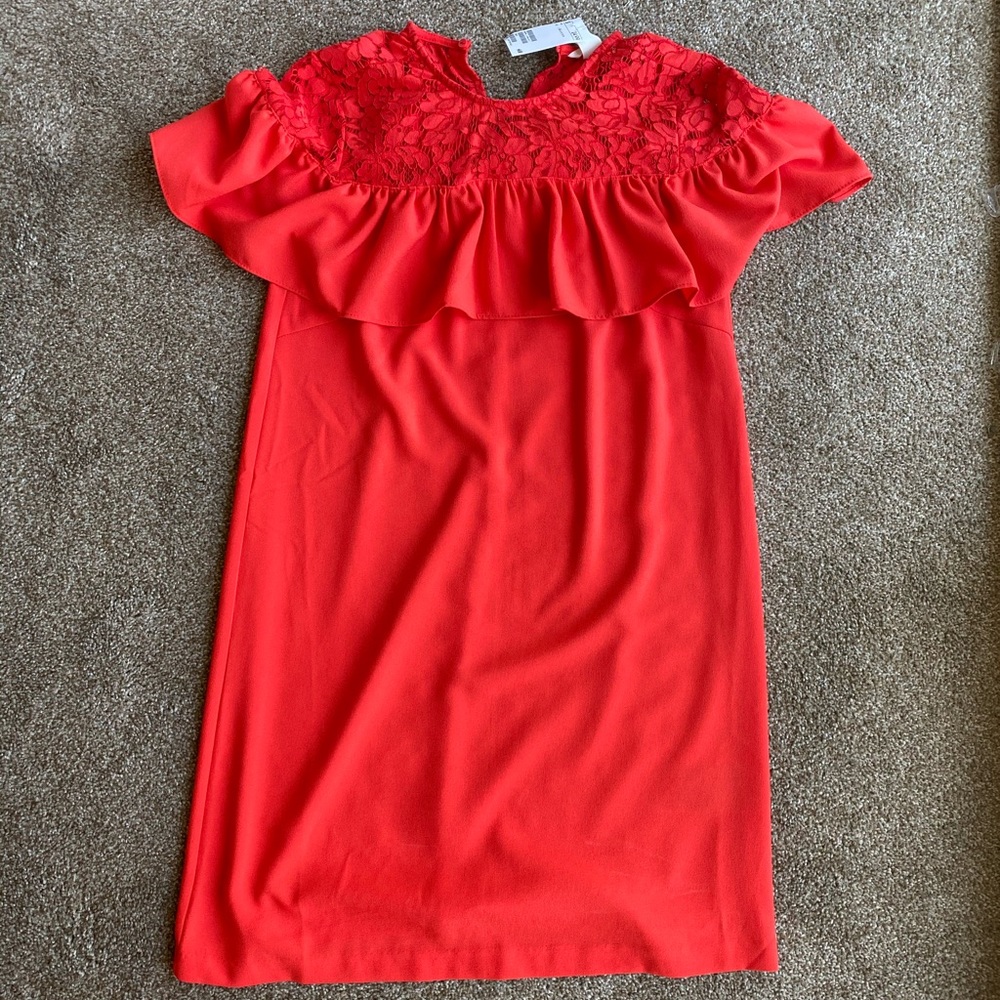 Red dress with lace detail.